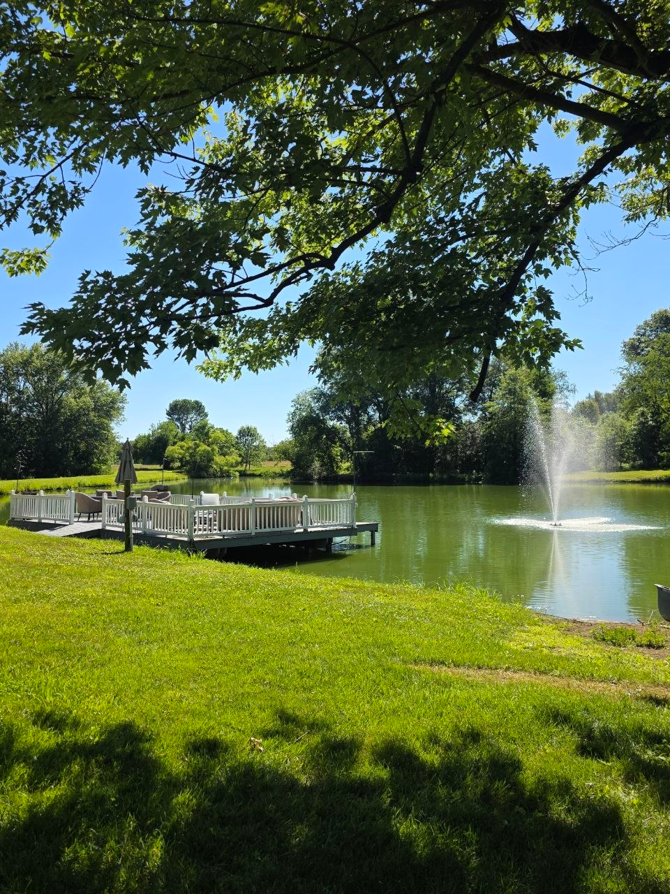 Lakeside deck beside the private lake and fountain