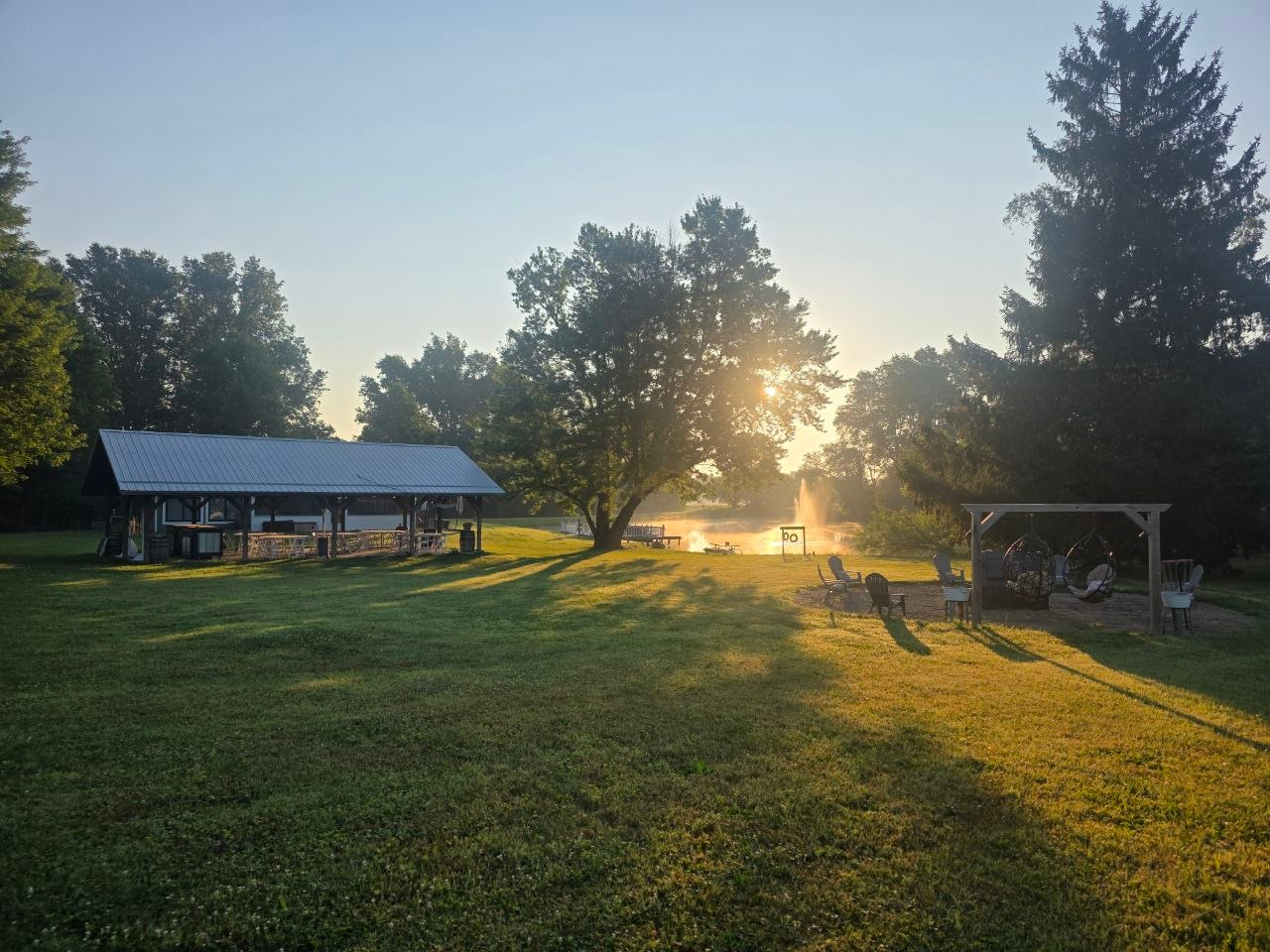 The Lake House pavilion and fire pit beside the water